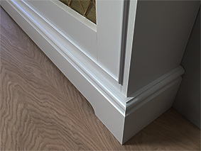 Radiator cover with brass foot detail